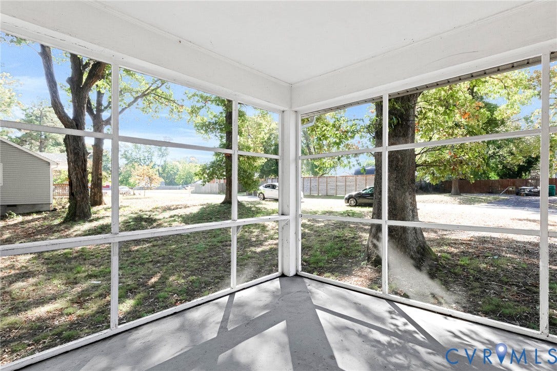 7304 Bowler Street, Henrico, VA 23228 Screened-in porch featuring a painted concrete floor and extensive white-framed window panels