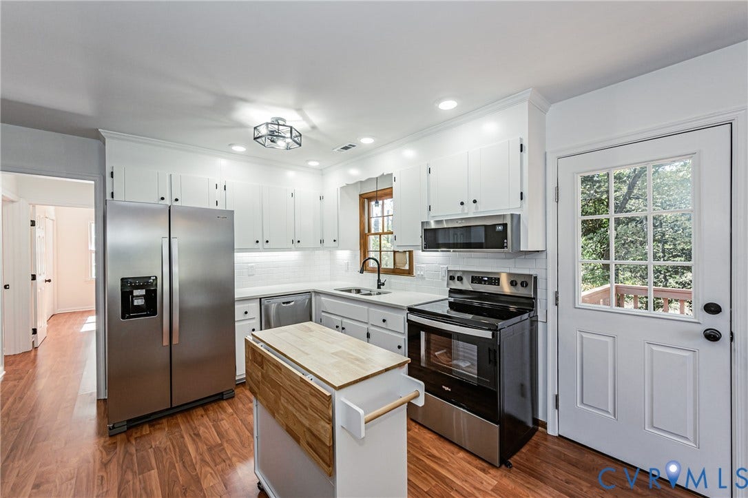 10100 Brittonwood Drive, Chesterfield, VA 23237 Kitchen featuring white cabinetry, wood-finish flooring, stainless steel appliances, white subway tile backsplash, and recessed lighting