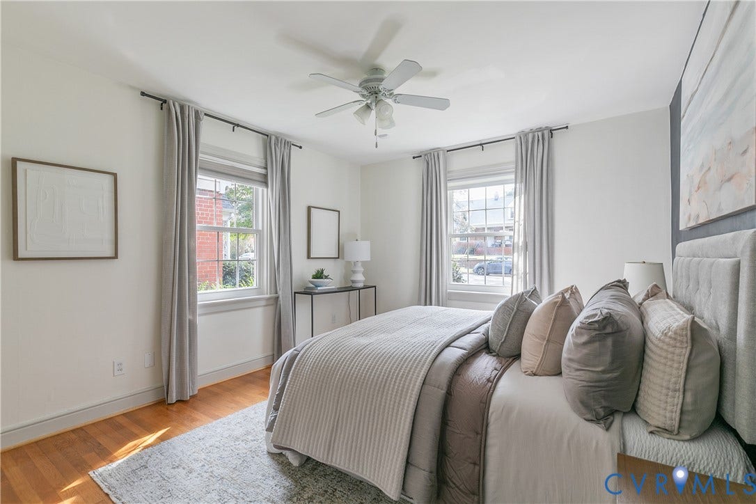 4710 Park Avenue, Mary Munford / Near West End, Richmond, VA 23226 Bright room featuring wood-finish flooring, two double-hung windows, and a central ceiling fan with integrated lighting