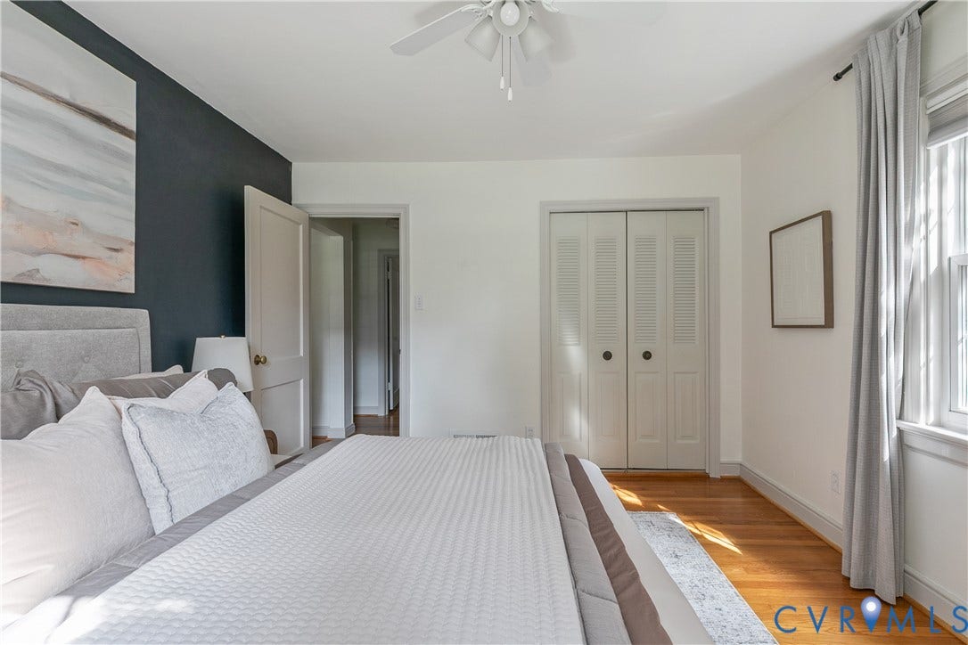 4710 Park Avenue, Mary Munford / Near West End, Richmond, VA 23226 Hardwood flooring, dark-toned accent wall, dual-paneled closet doors, and central ceiling fan with integrated lighting