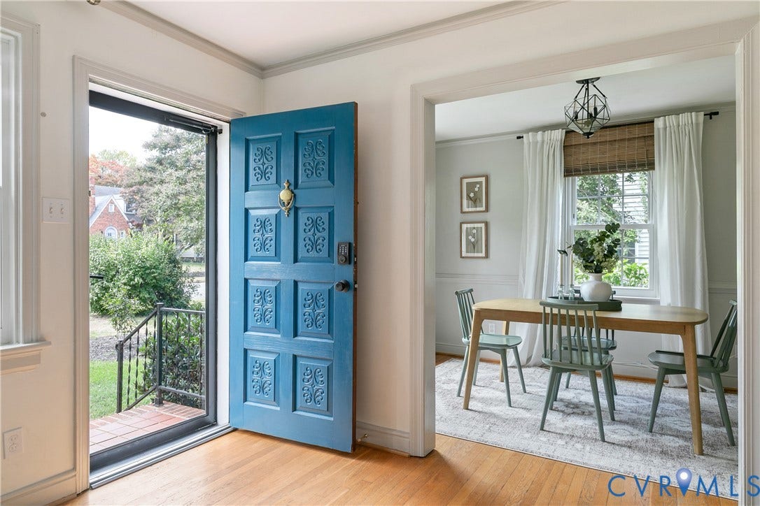 4710 Park Avenue, Mary Munford / Near West End, Richmond, VA 23226 Entryway featuring a bold blue paneled door with a brass knocker, wood-finish flooring, and a geometric pendant light fixture