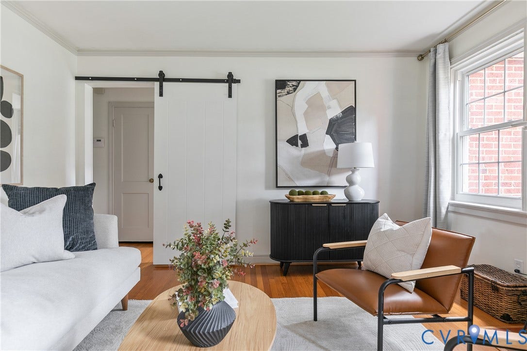 4710 Park Avenue, Mary Munford / Near West End, Richmond, VA 23226 White interior walls with crown molding, wood-finish flooring, and a white sliding barn door with black iron hardware