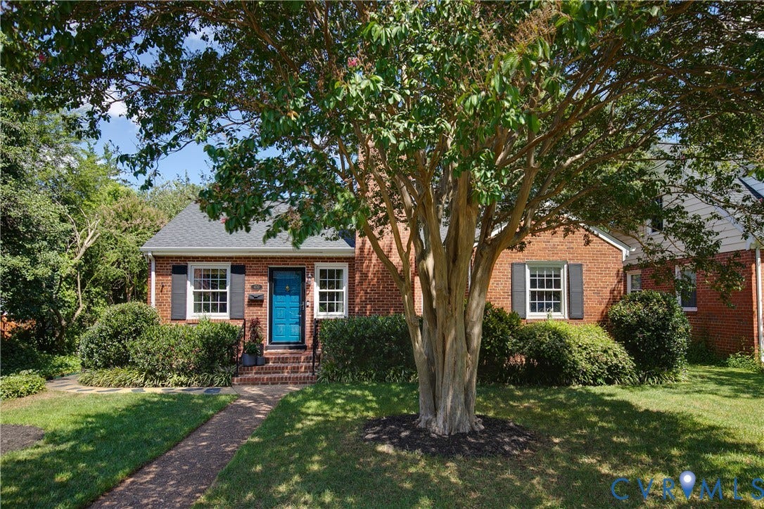 4710 Park Avenue, Mary Munford / Near West End, Richmond, VA 23226 Brick exterior featuring dark shutters, multi-pane windows, a brick chimney, and a paved walkway
