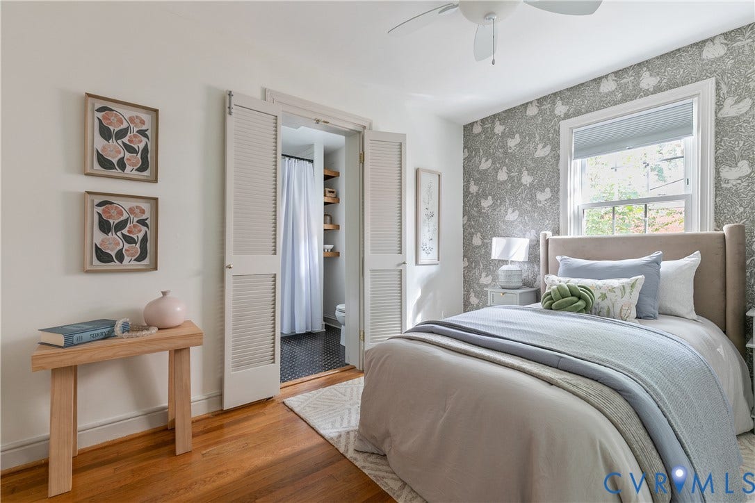 4710 Park Avenue, Mary Munford / Near West End, Richmond, VA 23226 Bedroom featuring wood-finish flooring, patterned accent wallpaper, double louvered closet doors, and an overhead ceiling fan