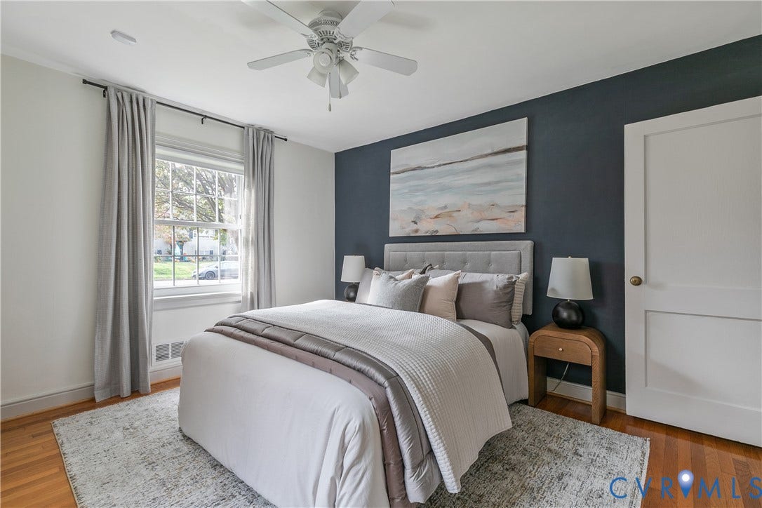 4710 Park Avenue, Mary Munford / Near West End, Richmond, VA 23226 Room featuring wood-finish flooring, a dark accent wall, and a multi-light ceiling fan