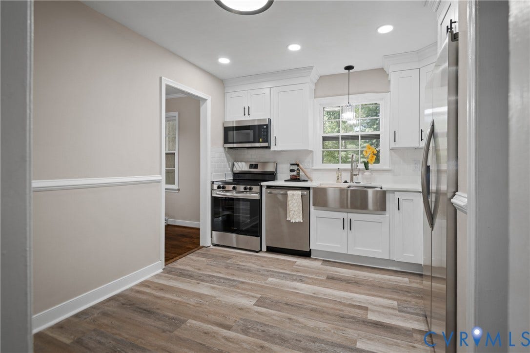 9010 Fawn Lane, Henrico, VA 23229 Kitchen featuring white shaker-style cabinetry, stainless steel farmhouse sink, wood-finish flooring, recessed lighting, and a subway tile backsplash