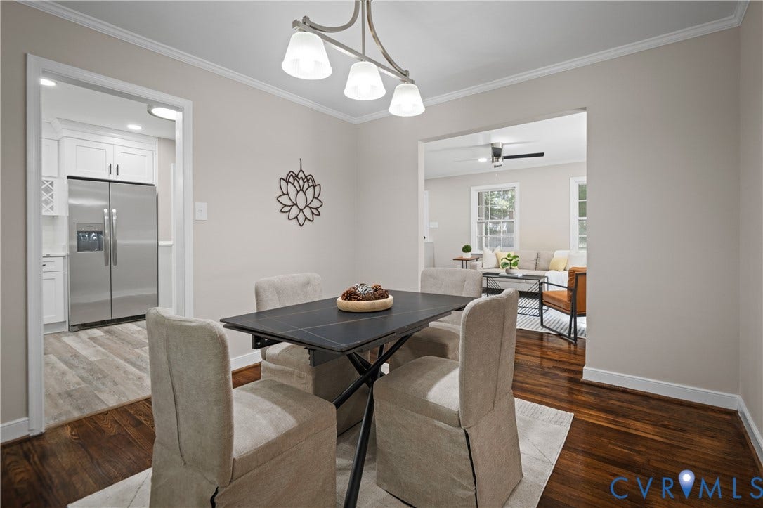 9010 Fawn Lane, Henrico, VA 23229 Dining area featuring crown molding, dark wood-finish flooring, and a three-light brushed metal chandelier