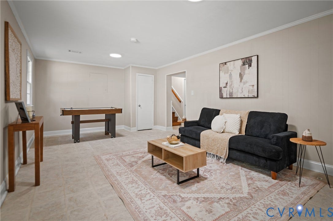 9010 Fawn Lane, Henrico, VA 23229 Neutral-toned interior space featuring light tile flooring, recessed ceiling lighting, and a circular skylight