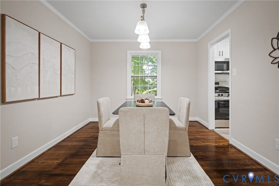 9010 Fawn Lane, Henrico, VA 23229 Dining area featuring dark wood-finish flooring, crown molding, and a three-light pendant fixture