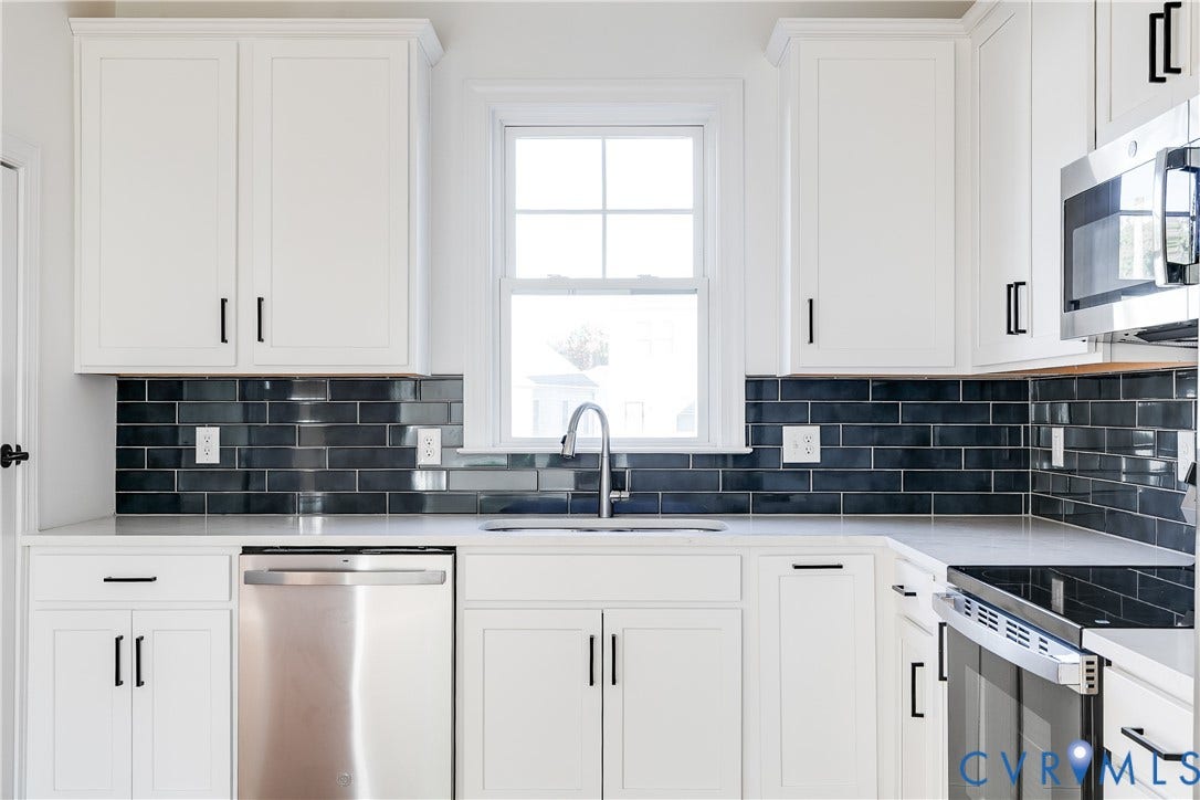 637 Ellens Haven Alley, Highland Grove, Richmond, VA 23222 Kitchen featuring white shaker-style cabinetry, dark subway tile backsplash, stainless steel appliances, neutral countertops, and a single-basin sink with a gooseneck faucet