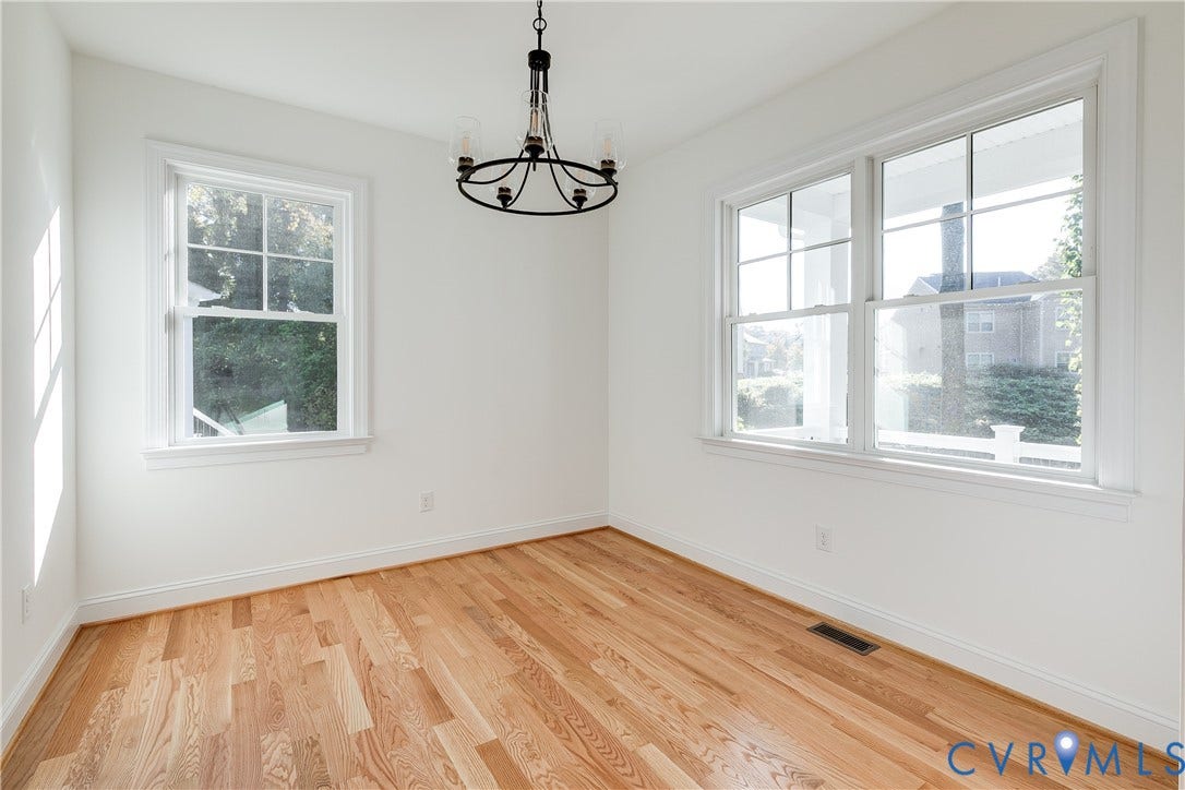 637 Ellens Haven Alley, Highland Grove, Richmond, VA 23222 Wood-finish flooring, multi-pane windows, and a black-finish metal chandelier