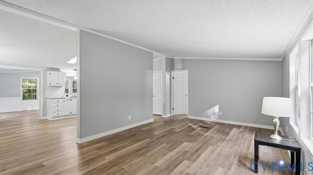 75 Claybank Road, Cumberland, VA 23040 Living area featuring wood-finish flooring, neutral wall tones, multi-panel interior doors, and crisp white trim