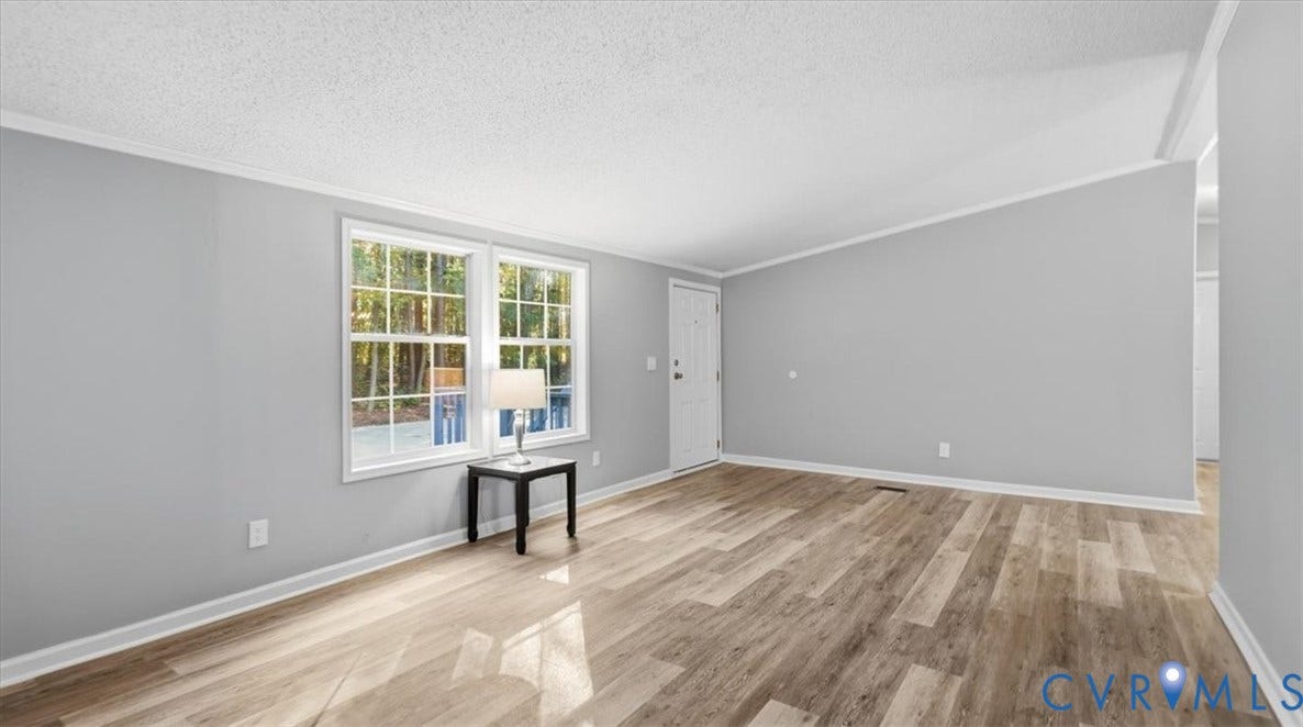 75 Claybank Road, Cumberland, VA 23040 Interior space featuring wood-finish flooring, neutral wall tones, multi-pane windows, and a sloped ceiling