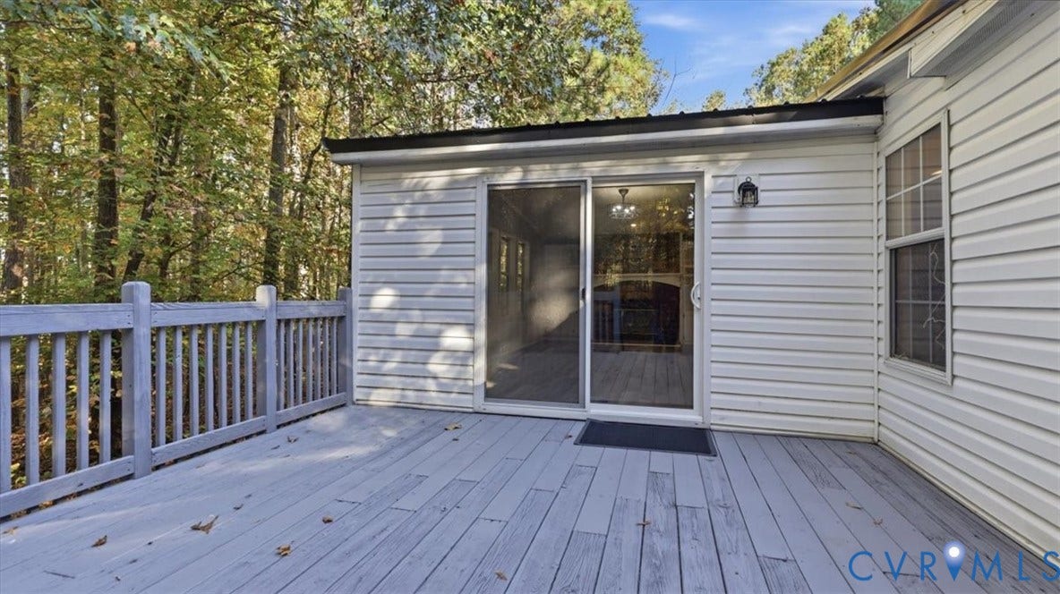 75 Claybank Road, Cumberland, VA 23040 Exterior deck featuring wood-finish decking, painted wooden railings, and sliding glass door access