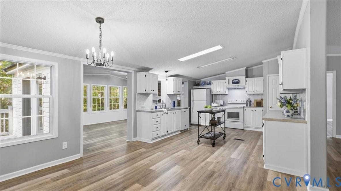 75 Claybank Road, Cumberland, VA 23040 Kitchen featuring white cabinetry, light-toned countertops, wood-finish flooring, a pendant chandelier, and recessed lighting