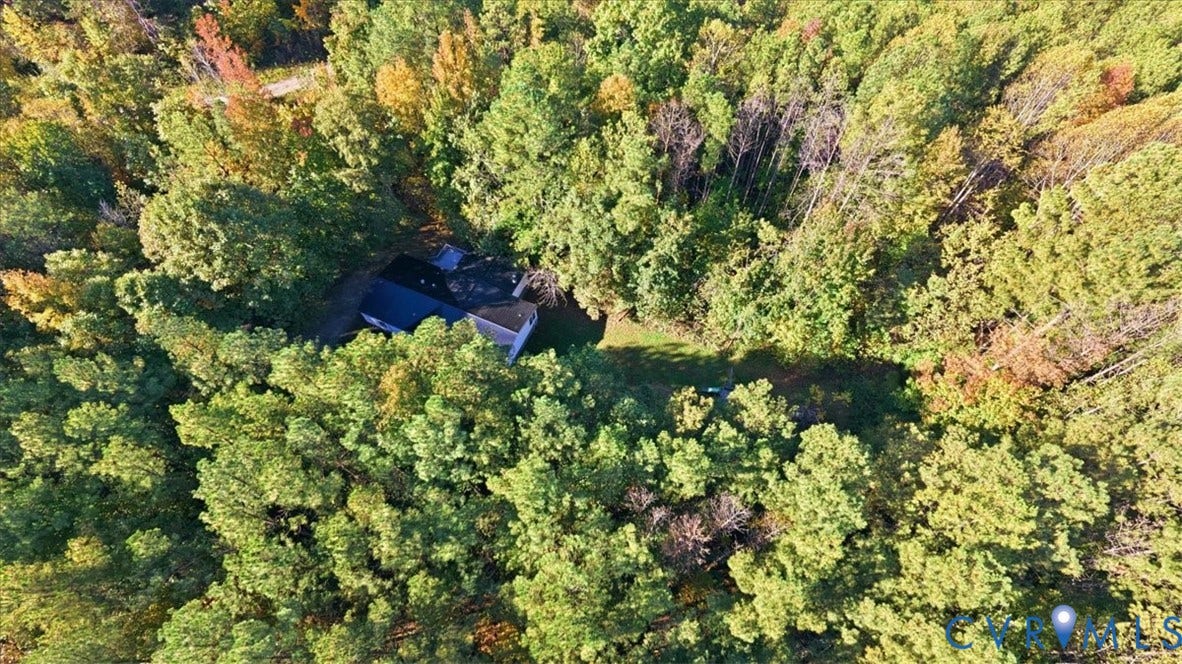 75 Claybank Road, Cumberland, VA 23040 Aerial perspective of a multi-pitched roof structure nestled within a dense forest of mature deciduous and evergreen trees