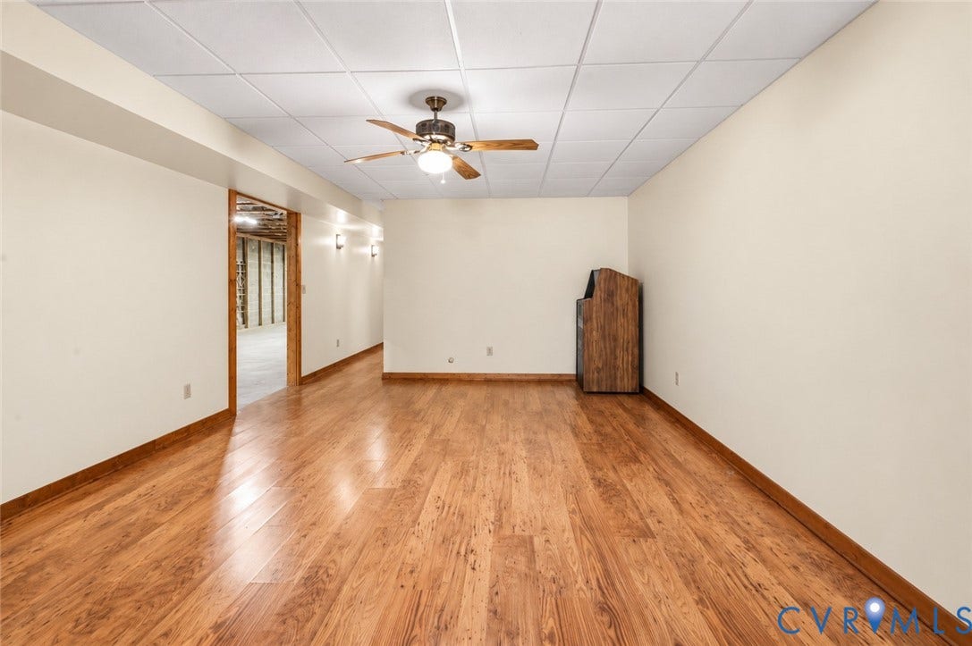 3621 Jefferson Highway, Mineral, VA 23093 Finished interior room featuring wood-finish flooring, a dropped ceiling, and a central ceiling fan with integrated lighting