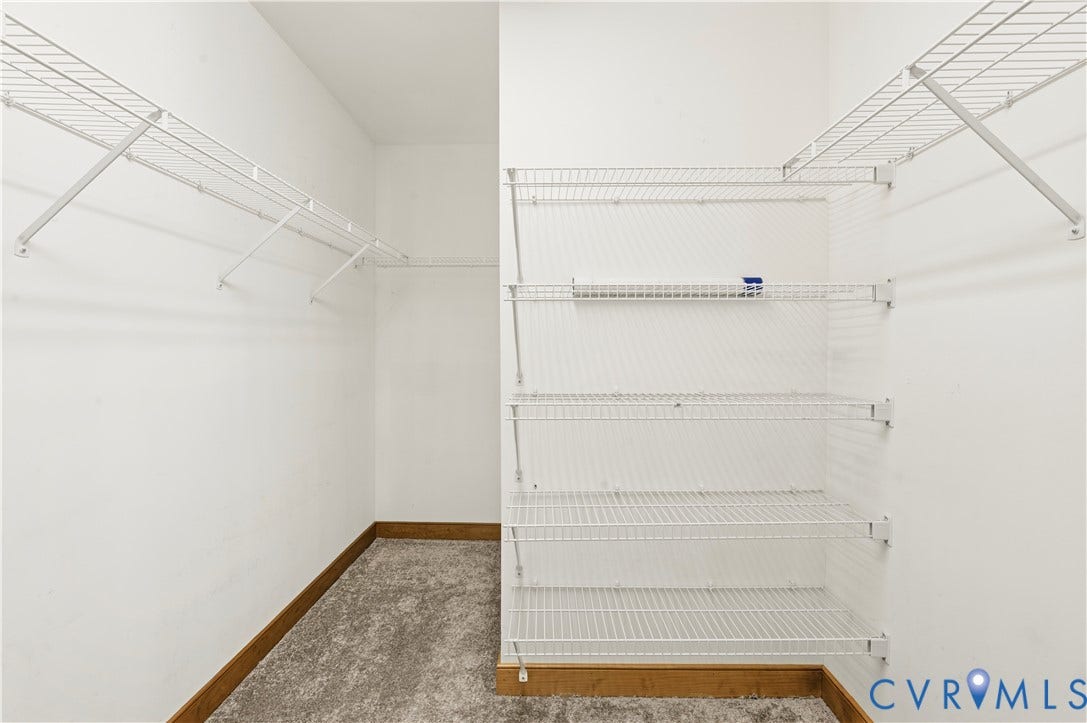 3621 Jefferson Highway, Mineral, VA 23093 Walk-in closet featuring tiered white wire shelving and neutral carpeting