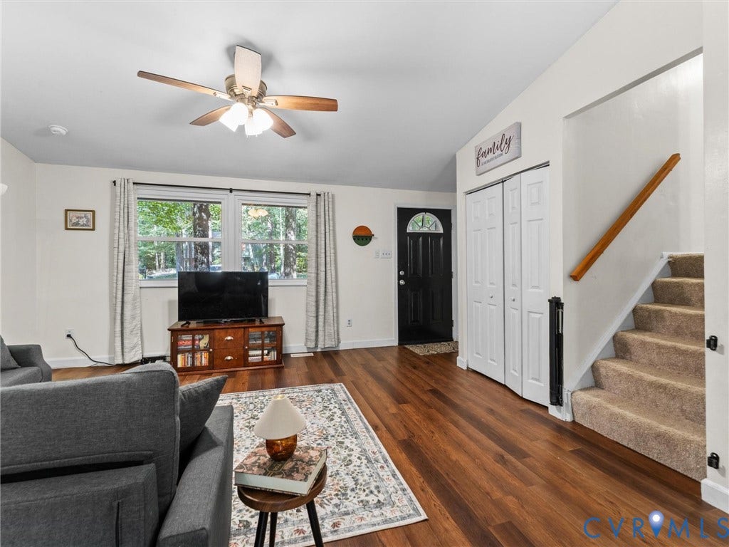2703 Sutters Mill Court, Sutters Mill, Chesterfield, VA 23112 Vaulted ceiling with integrated multi-light ceiling fan, wood-finish flooring, dual-panel closet doors, and staircase with wooden handrail
