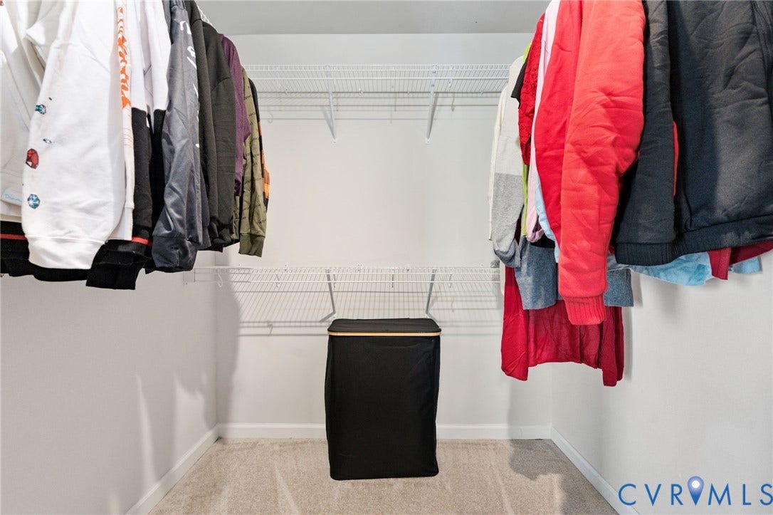 640 Rivanna Hill Road, Glen Allen, VA 23060 A walk-in closet offers hanging space and shelving on multiple sides to keep clothing and everyday essentials organized.