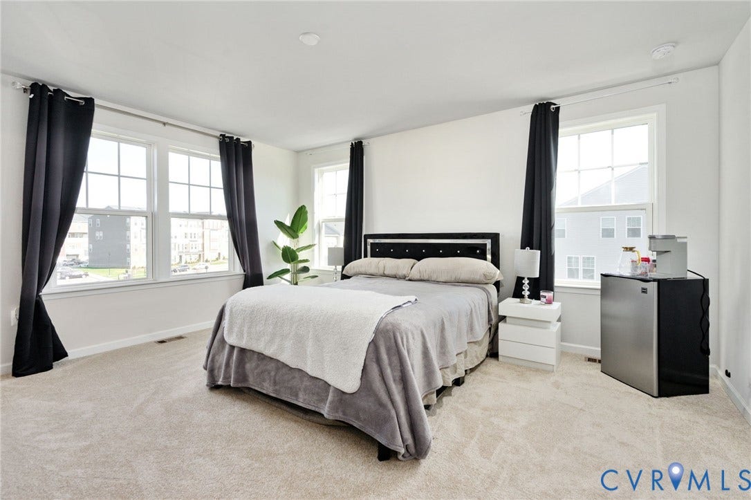 640 Rivanna Hill Road, Glen Allen, VA 23060 The spacious primary bedroom enjoys abundant natural light from windows on two sides, creating a bright and inviting retreat.