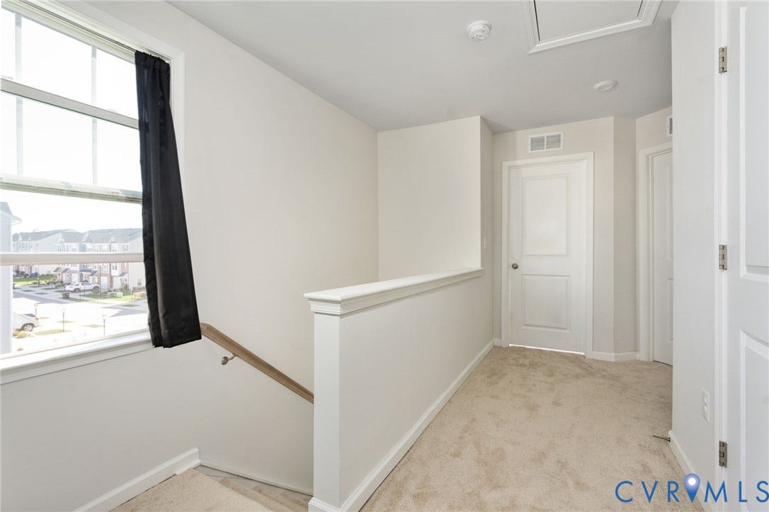 640 Rivanna Hill Road, Glen Allen, VA 23060 A large window brightens the third-level landing, connecting the bedrooms, hall bath, and laundry area.
