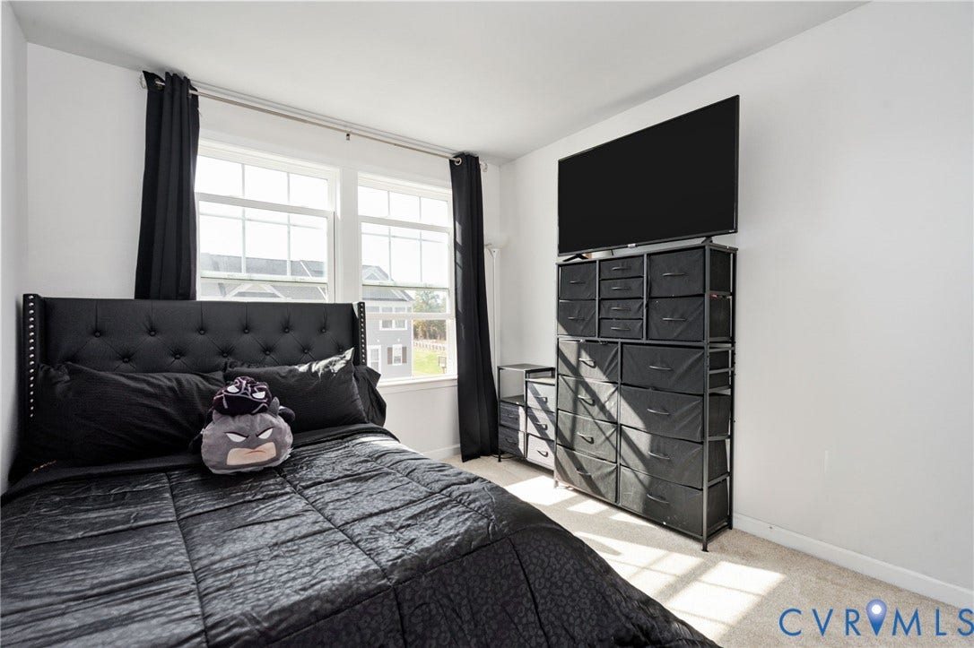640 Rivanna Hill Road, Glen Allen, VA 23060 Natural light fills the third bedroom, offering a comfortable space with neutral finishes ready for your personal style.