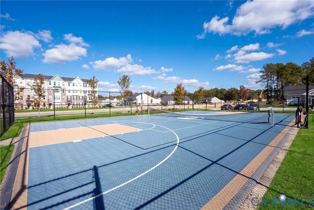 640 Rivanna Hill Road, Glen Allen, VA 23060 Enjoy outdoor recreation on the fenced community sports court, featuring basketball markings and a net for court games.
