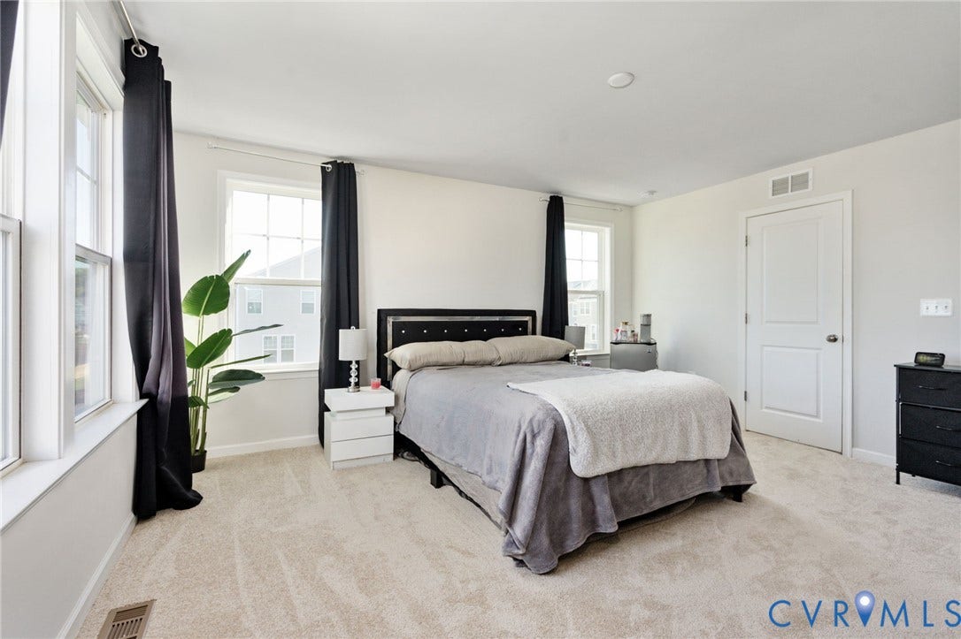 640 Rivanna Hill Road, Glen Allen, VA 23060 This alternate view showcases the primary bedrooms generous layout, neutral finishes, and room for additional furnishings.