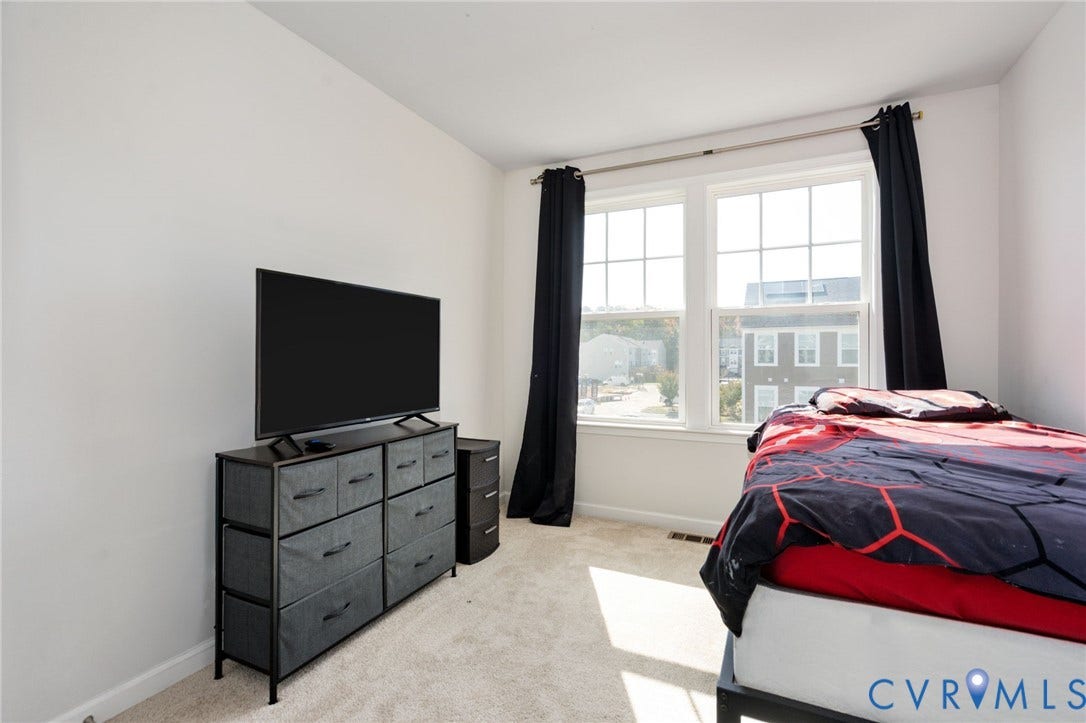 640 Rivanna Hill Road, Glen Allen, VA 23060 The second bedroom features two large windows, neutral walls, and comfortable carpeting, with flexibility for guests or a home office.
