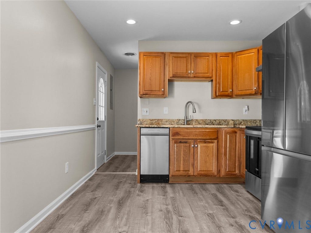 3303 Jowin Lane, Henrico, VA 23223 Kitchen featuring natural wood cabinetry, stone-surface countertops, stainless steel appliances, recessed lighting, and wood-finish flooring