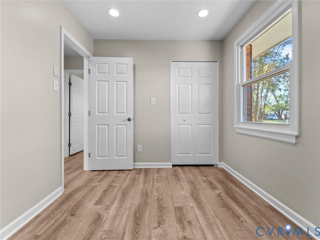 3303 Jowin Lane, Henrico, VA 23223 Room featuring wood-finish flooring, recessed lighting, and a dual-panel closet