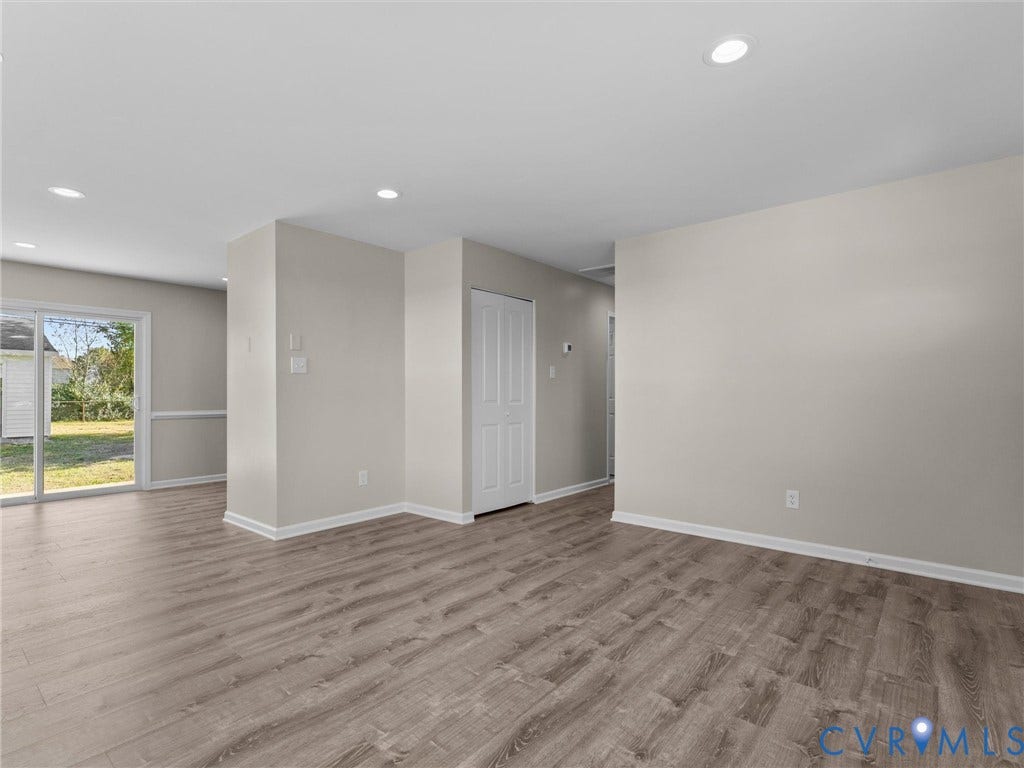3303 Jowin Lane, Henrico, VA 23223 Neutral interior space featuring wood-finish flooring, recessed lighting, and a sliding glass door