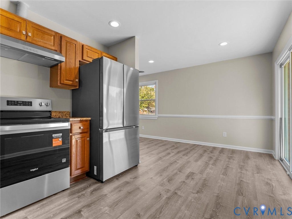 3303 Jowin Lane, Henrico, VA 23223 Kitchen featuring wood cabinetry, stainless steel appliances, recessed lighting, wood-finish flooring, and sliding glass doors