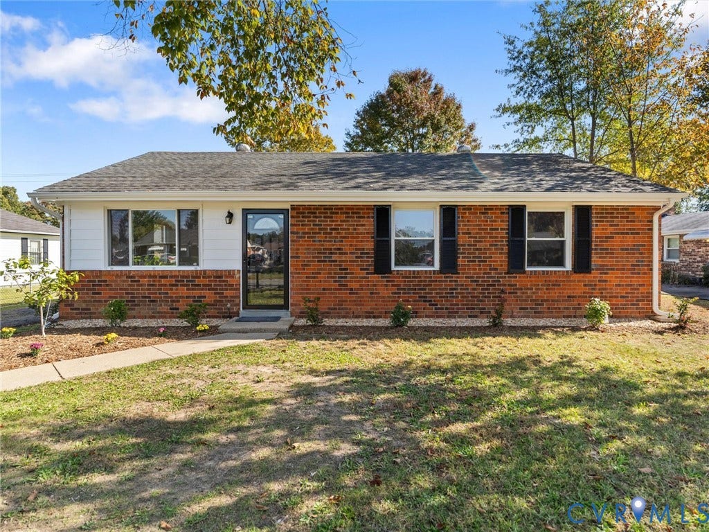 3303 Jowin Lane, Henrico, VA 23223 Single-story ranch exterior featuring a brick and siding facade, asphalt shingle roof, dark window shutters, and a front entry door with a decorative glass insert