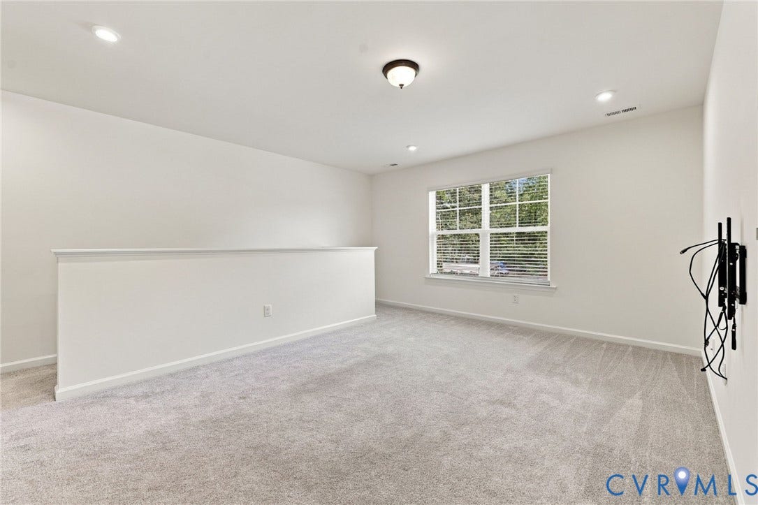 7712 Hawthorne Avenue, Henrico, VA 23227 Neutral-toned wall-to-wall carpeting, recessed ceiling lighting, central flush-mount fixture, and large multi-pane window