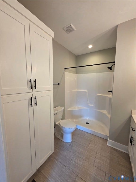3005 Portsmouth Street, Hopewell, VA 23860 Floor-to-ceiling white cabinetry with matte black hardware, tile flooring, and a walk-in shower enclosure featuring matte black fixtures