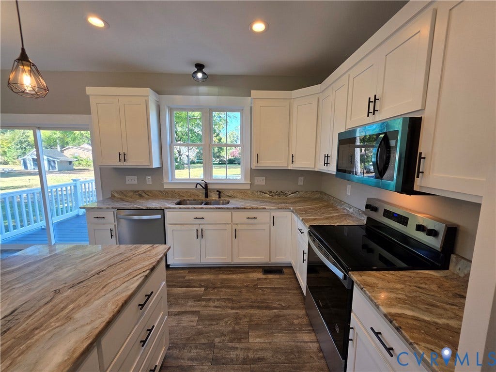 3005 Portsmouth Street, Hopewell, VA 23860 Kitchen featuring white cabinetry with dark hardware, stone-finish countertops, stainless steel appliances, and wood-finish flooring