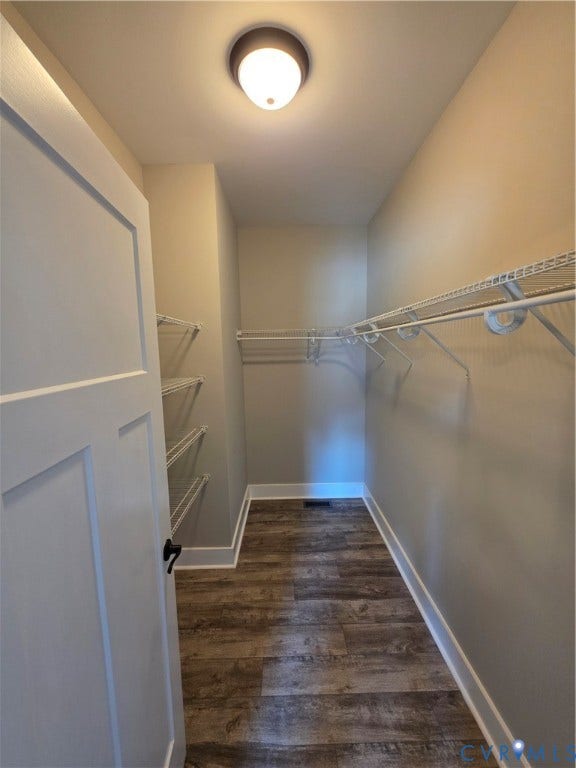 3005 Portsmouth Street, Hopewell, VA 23860 Walk-in storage space featuring wood-finish flooring, white paneled door, flush-mount lighting, and tiered white wire shelving