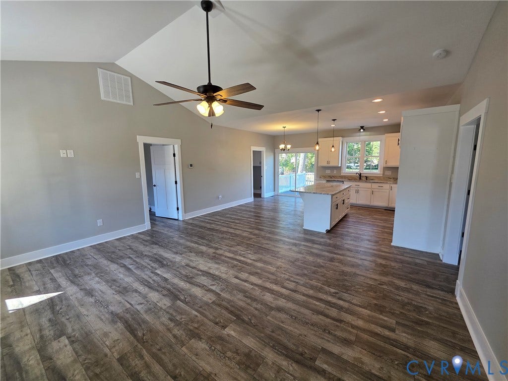 3005 Portsmouth Street, Hopewell, VA 23860 Vaulted ceiling with a central fan, open-concept kitchen featuring an island, and wood-finish flooring throughout