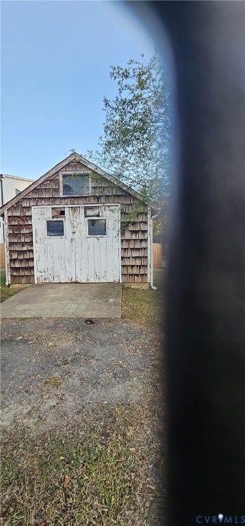3601 Idlewood Avenue, Windsor Farms, Richmond, VA 23221 Detached outbuilding featuring shingle siding, a gable roofline, double doors with inset glazing, and a concrete entry pad