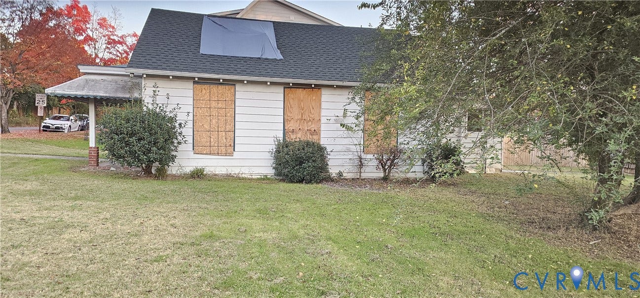 3601 Idlewood Avenue, Windsor Farms, Richmond, VA 23221 Single-story residence featuring light-colored horizontal siding, an asphalt shingle roof, a covered side porch with a brick-base pillar, and established greenery