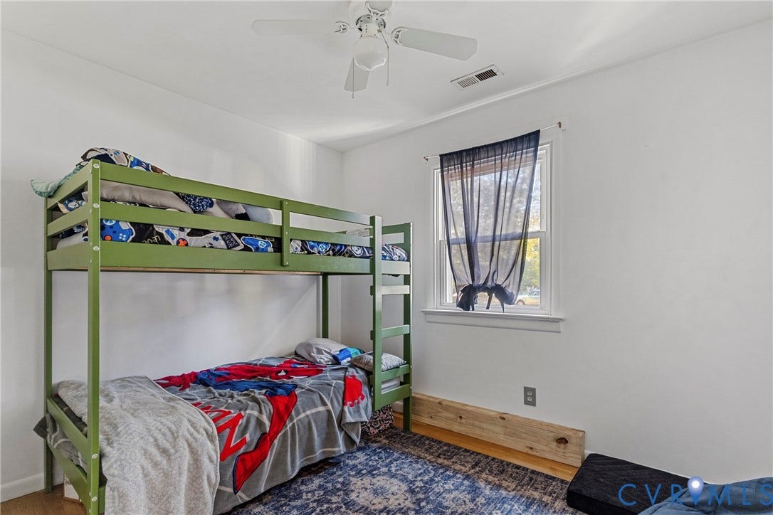 8444 New London Road, Mechanicsville, VA 23116 Neutral-toned room featuring a single-hung window with white casing, a white ceiling fan with integrated lighting, and light-toned hard-surface flooring