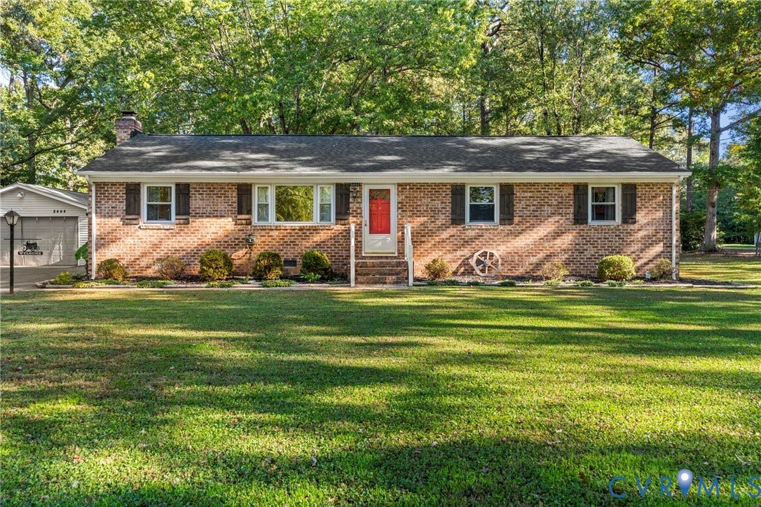 8444 New London Road, Mechanicsville, VA 23116 Single-story brick exterior featuring a multi-pane window configuration, asphalt shingle roof, attached garage, and expansive lawn