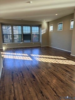 2144 Perennial Circle, Henrico, VA 23233 Spacious room featuring wood-finish flooring, a large bay window, recessed ceiling lighting, and multiple square-pane windows