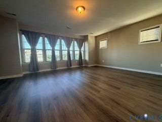 2144 Perennial Circle, Henrico, VA 23233 Expansive room featuring wood-finish flooring, a series of windows, and a central ceiling light fixture