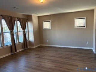 2144 Perennial Circle, Henrico, VA 23233 Spacious interior featuring wood-finish flooring, neutral wall tones, multi-pane windows, and inset ceiling lighting