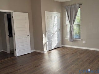 2144 Perennial Circle, Henrico, VA 23233 Room featuring wood-finish flooring, white paneled doors, and a double-door closet with metallic hardware