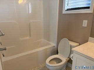 2144 Perennial Circle, Henrico, VA 23233 Bathroom featuring a tub-and-shower combination with a molded surround, a white vanity with a solid-surface countertop, and a window with horizontal blinds