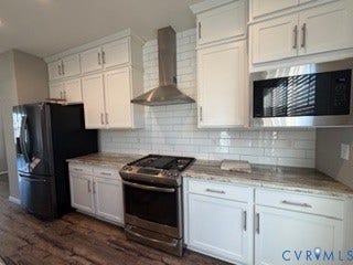 2144 Perennial Circle, Henrico, VA 23233 Kitchen featuring white cabinetry, stone-surface countertops, subway tile backsplash, stainless steel appliances, and wood-finish flooring